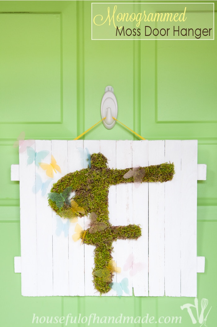 I'm so excited for spring! Make this easy DIY monogrammed moss door hanger instead of a wreath to welcome in the warm weather! | Housefulofhandmade.com