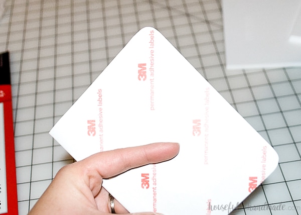 The label folded in half and the corners rounded witch scissors.