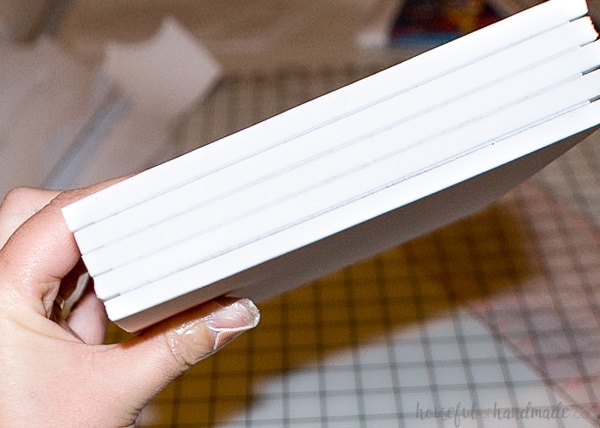 Holding the completed custom kids book closed without the cover on.