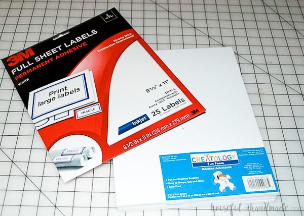 Package of full sheet labels for the printer and white craft foam sheets on a craft table.