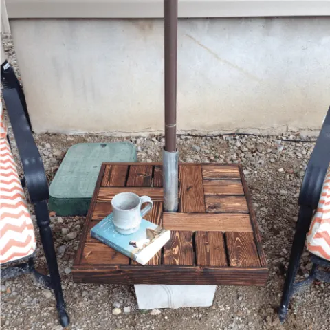 Make your own umbrella stand with a side table for cheap. Makes the perfect seating area to enjoy summer. Tutorial from Houseful of Handmade.