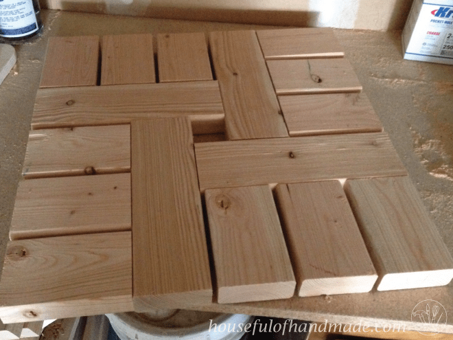 pieces of cut wood shown together to make umbrella stand side table top 