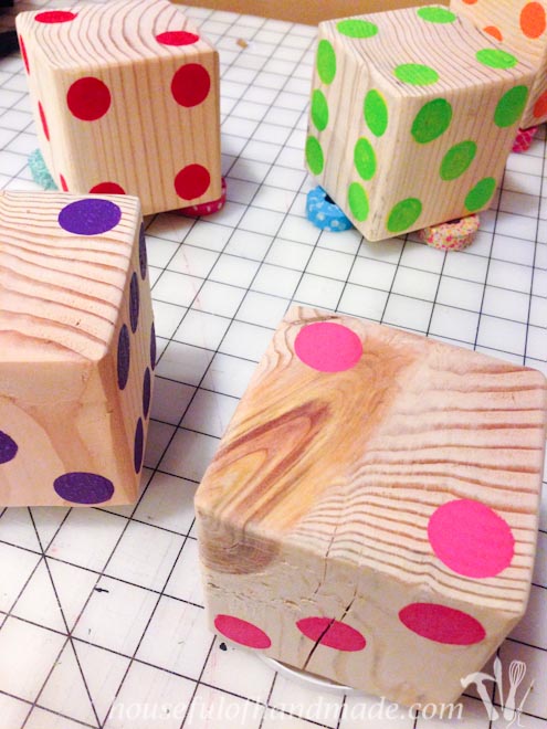 Make up a set of colorful yard dice to take to your next get together. Tutorial on Houseful of Handmade.