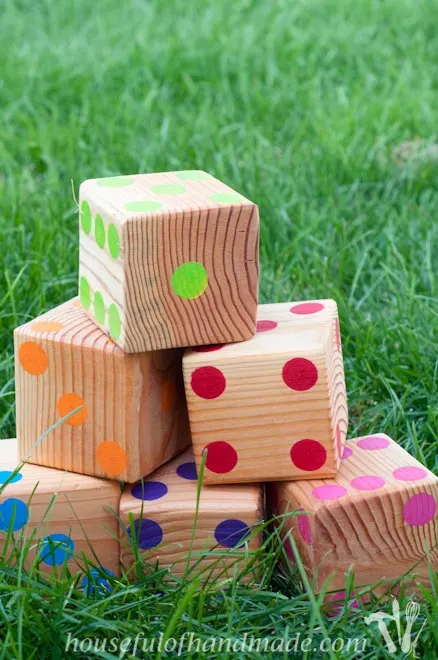 Make up a set of colorful yard dice to take to your next get together. Tutorial on Houseful of Handmade.