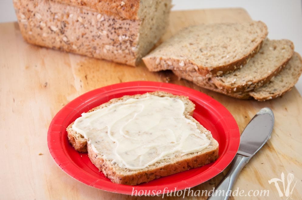 This bread is so delicious! A soft but hearty whole grain seed bread made with whole wheat, oats and seeds. Recipe on Houseful of Handmade.