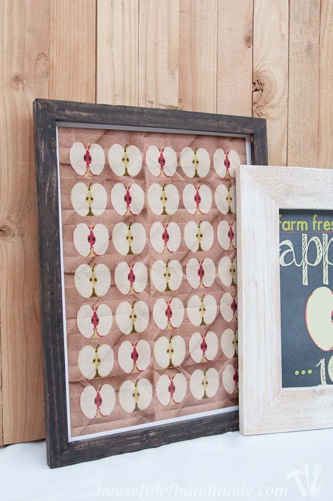 two diy rustic picture frames with apple printables shown on mantel