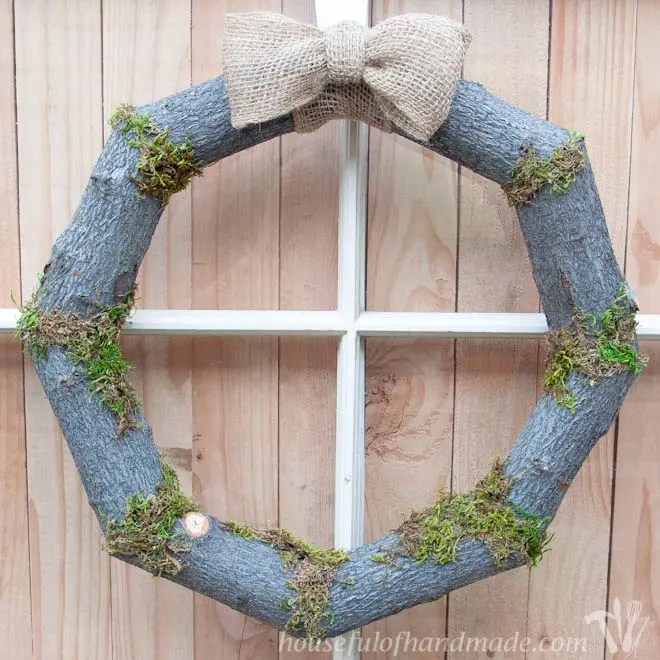 Rustic wreath for fall made from branches trimmed from a tree.