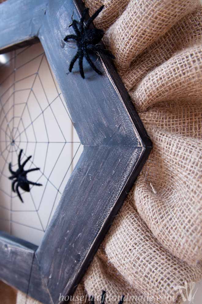 Make a simple, spooky spider web wreath for Halloween. I just love the way the string web looks with the fuzzy spiders. Tutorial on Houseful of Handmade.