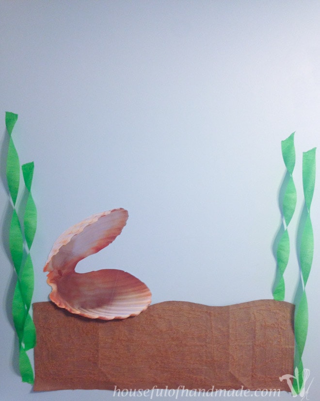 Pin the pearl in the clam backdrop for a mermaid themed tea party