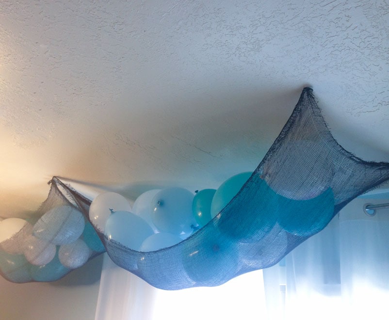 Balloons in a net for mermaid party decoration ideas