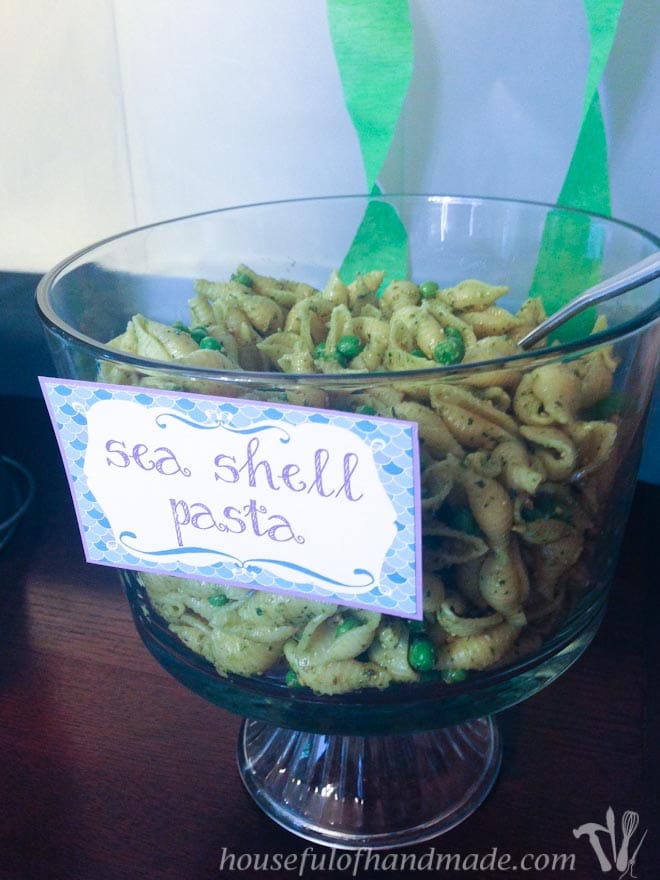 bowl of pasta with a sign is a great mermaid birthday party food idea