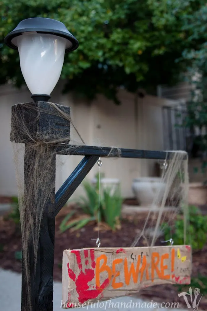 Add some Halloween flair to you front yard with this Halloween lamppost. A spooky sign and inexpensive solar light make this an easy build for a beginner. Tutorial from housefulofhandmade.com.