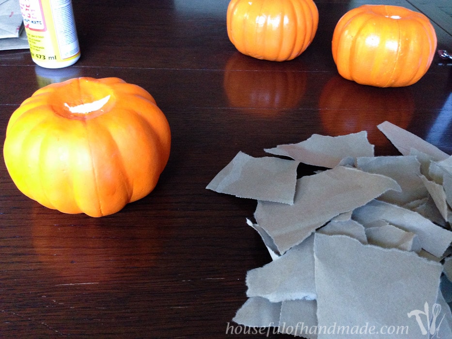 These pumpkins are beautiful. It's hard to believe they were ugly dollar store pumpkins. See how to make easy rustic pumpkins from dollar store pumpkins for only a couple dollars! | HousefulofHandmade.com