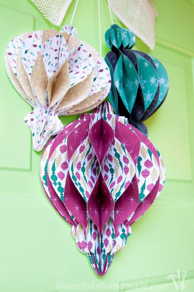 Decorate your door with this beautiful DIY giant paper ornament Christmas wreath. Fun and easy to make! | CraftingMyHome.com