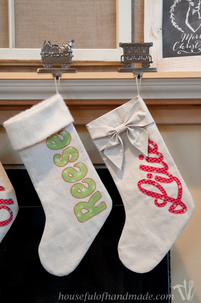 personalized drop cloth Christmas stockings hanging on fireplace mantel