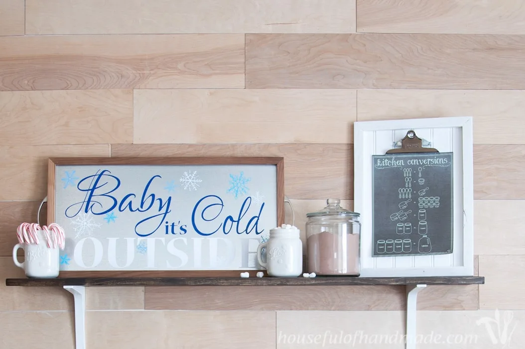 Time to warm up with this adorable decor for your hot cocoa or coffee station. Make a Baby It's Cold outside sign out of a DIY metal serving tray! | Housefulofhandmade.com | Housefulofhandmade.com
