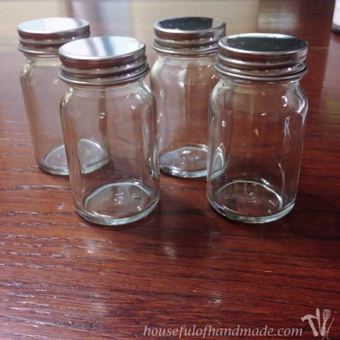 I love having a place to hold all the K-cups and fun spices for our coffee station. This DIY Rustic K-cup Holder with Spice Shakers is the perfect way to display them on a counter and it is super easy to make. | Housefulofhandmade.com