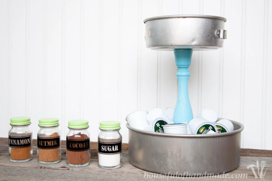 I love having a place to hold all the K-cups and fun spices for our coffee station. This DIY Rustic K-cup Holder with Spice Shakers is the perfect way to display them on a counter and it is super easy to make. | Housefulofhandmade.com