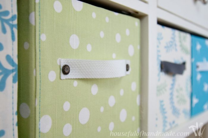 close up of fabric covered diy storage boxes with handles