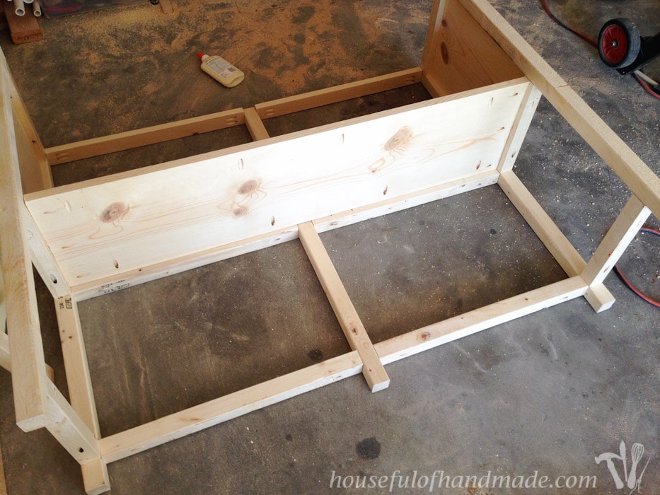 Attaching the top shelf of the coffee station table to the 2x2 sides with pocket holes. 