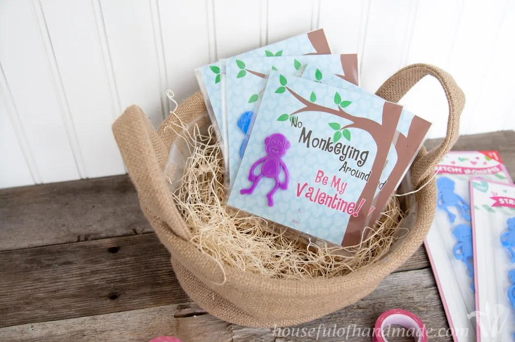 I love non-candy Valentines for the kids. These free printable monkey Valentines use stretchy monkeys from the Dollar Spot. Super cute and easy! | Housefulofhandmade.com