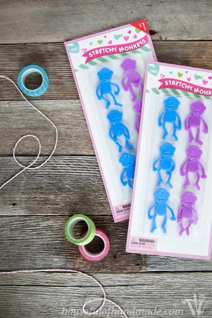 I love non-candy Valentines for the kids. These free printable monkey Valentines use stretchy monkeys from the Dollar Spot. Super cute and easy! | Housefulofhandmade.com