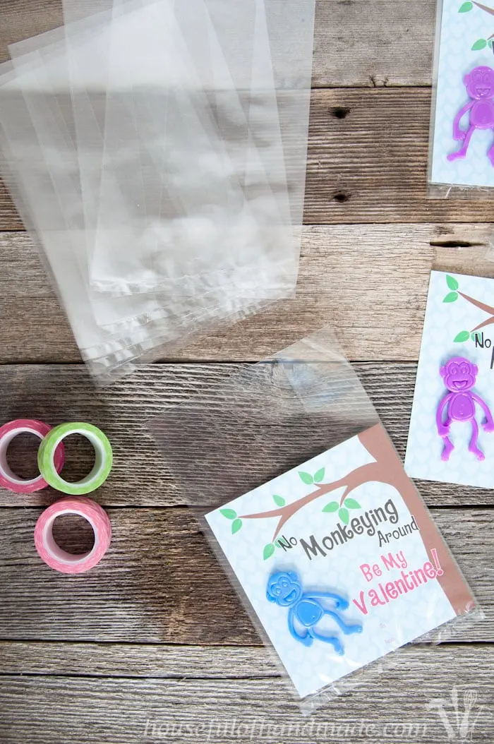 I love non-candy Valentines for the kids. These free printable monkey Valentines use stretchy monkeys from the Dollar Spot. Super cute and easy! | Housefulofhandmade.com