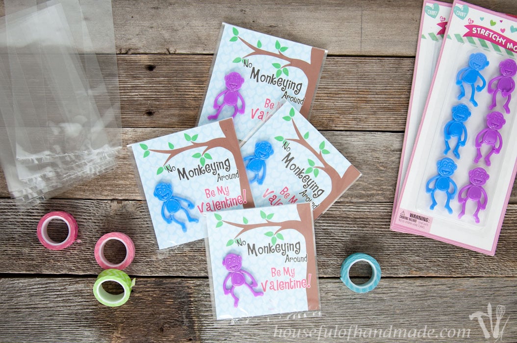 I love non-candy Valentines for the kids. These free printable monkey Valentines use stretchy monkeys from the Dollar Spot. Super cute and easy! | Housefulofhandmade.com