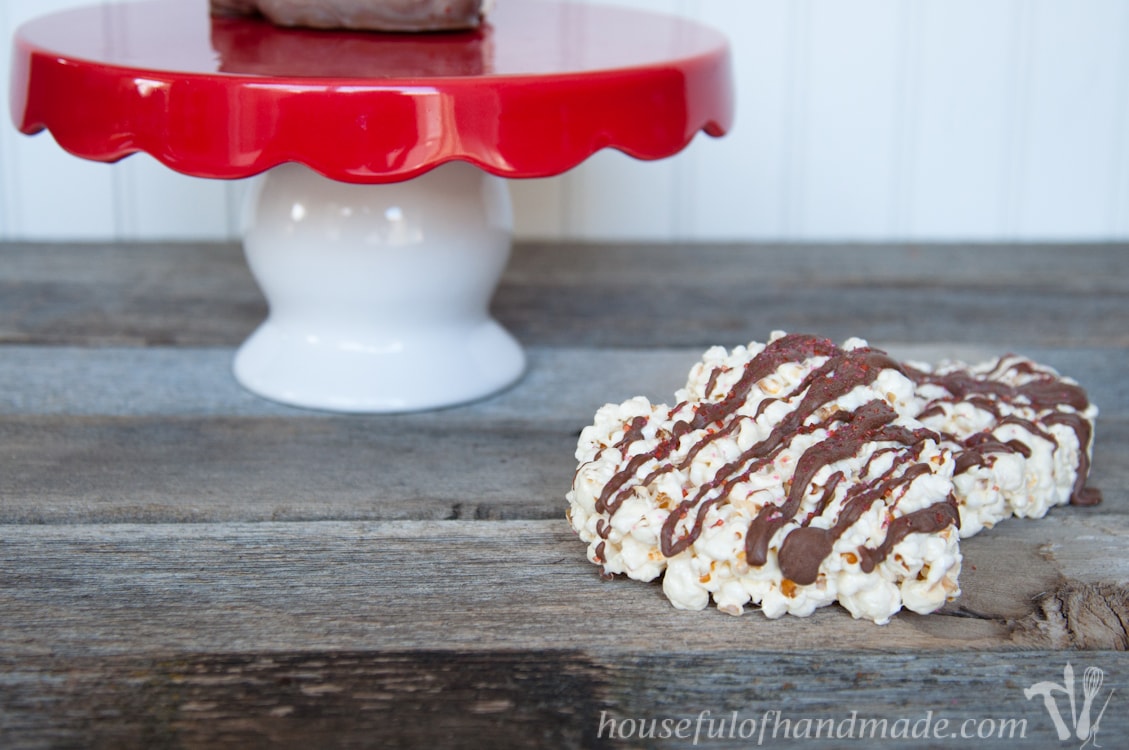 Make some extra special treats for Valentine's Day with these super easy, Chocolate Dipped Marshmallow Popcorn Hearts. | Housefulofhandmade.com
