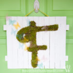 I'm so excited for spring! Make this easy DIY monogrammed moss door hanger instead of a wreath to welcome in the warm weather! | Housefulofhandmade.com