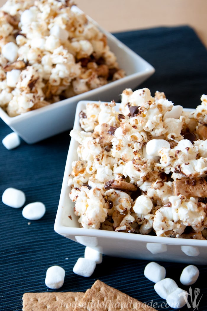 This is the best gooey popcorn. A mix of marshmallow, chocolate, and graham cracker make this super delicious S'mores Caramel Popcorn. | HousefulOfHandmade.com