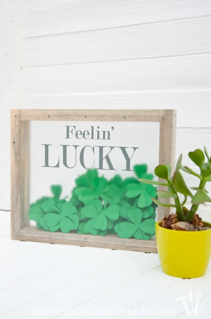 I love this fun St. Patrick's Day shadow box. The perfect way to bring a little green to your decor. | Housefulofhandmade.com