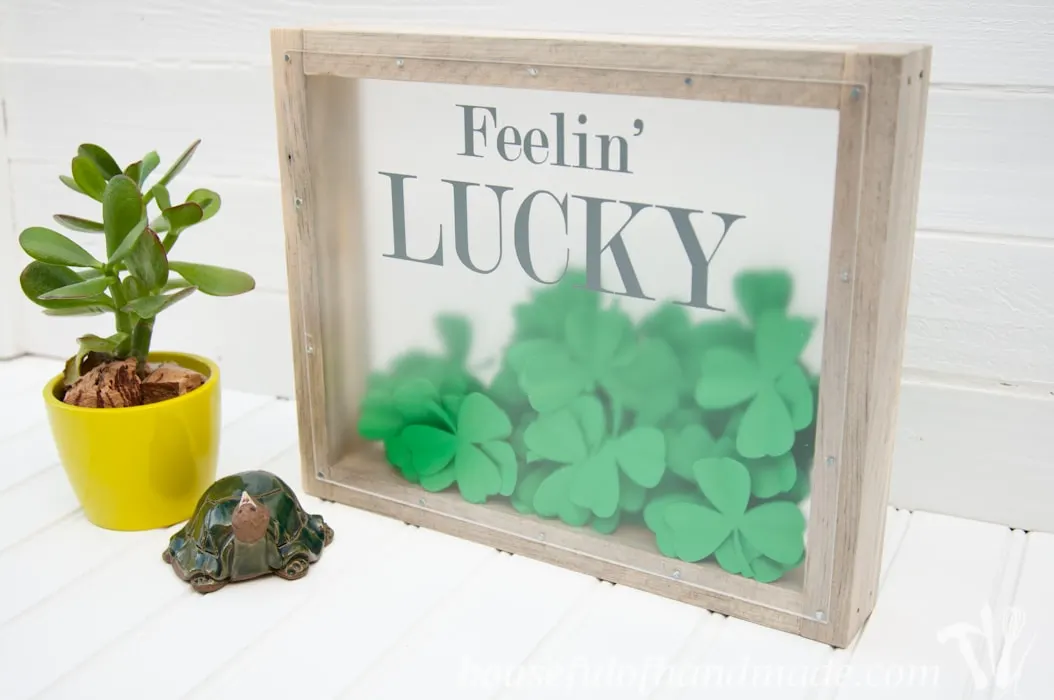 I love this fun St. Patrick's Day shadow box. The perfect way to bring a little green to your decor. | Housefulofhandmade.com