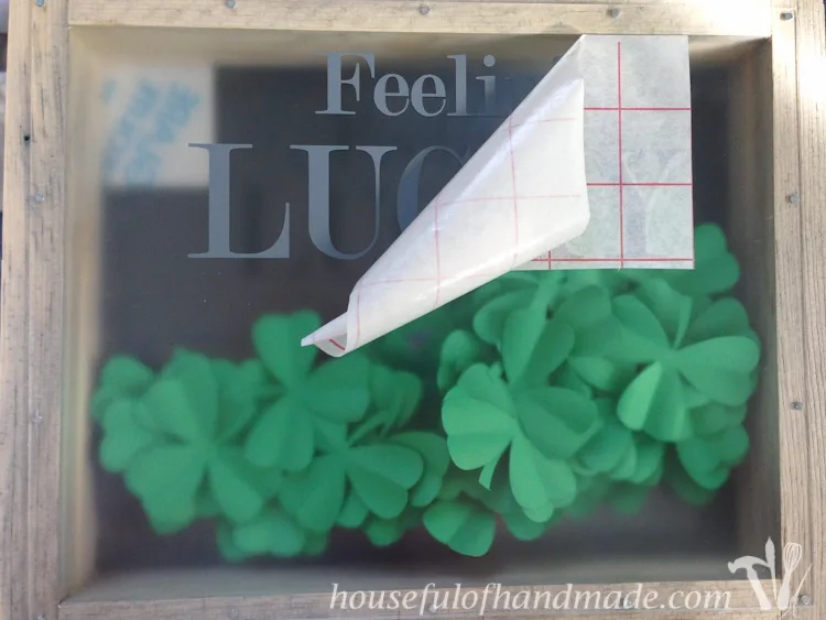 Made a beautiful shadow box full of clovers for a fun St. Patrick's Day shadow box decor idea. See if you can find the 1 4 leaf clover in the bunch. 