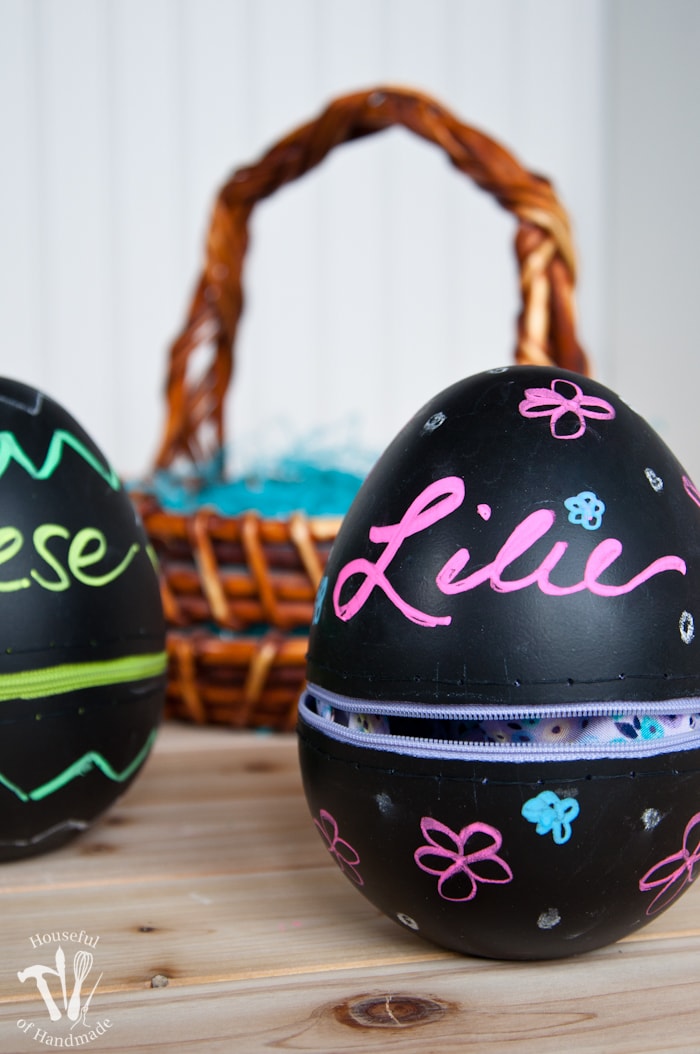 Turn boring decorative eggs into a jumbo chalkboard zipper Easter eggs to fill with clothes or toys. A simple and fun DIY for the perfect Easter basket! | Housefulofhandmade.com