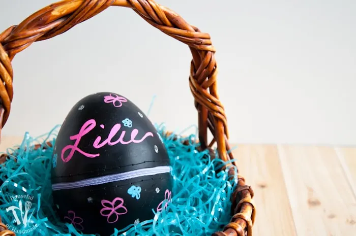 Turn boring decorative eggs into a jumbo chalkboard zipper Easter eggs to fill with clothes or toys. A simple and fun DIY for the perfect Easter basket! | Housefulofhandmade.com