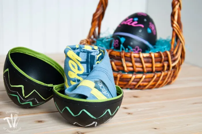 Turn boring decorative eggs into a jumbo chalkboard zipper Easter eggs to fill with clothes or toys. A simple and fun DIY for the perfect Easter basket! | Housefulofhandmade.com