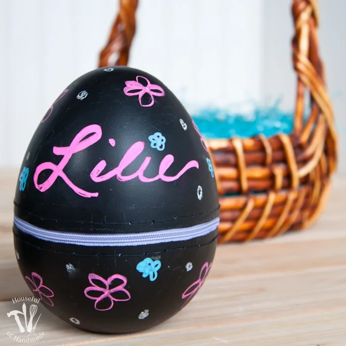 Turn boring decorative eggs into a jumbo chalkboard zipper Easter eggs to fill with clothes or toys. A simple and fun DIY for the perfect Easter basket! | Housefulofhandmade.com