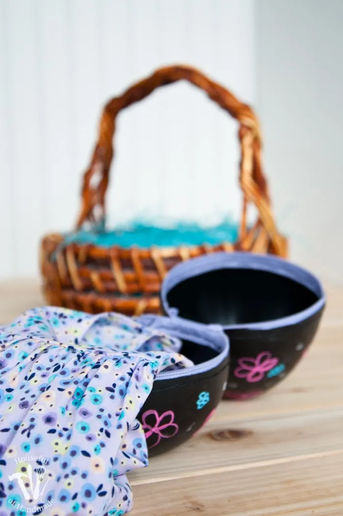 Turn boring decorative eggs into a jumbo chalkboard zipper Easter eggs to fill with clothes or toys. A simple and fun DIY for the perfect Easter basket! | Housefulofhandmade.com