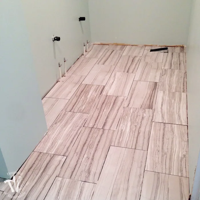 I've been working hard on the master bathroom remodel. This week I tackled tiling and learned a lot. Check out the update on the bathroom and see what I learned so you can avoid making the same mistakes. | Housefulofhandmade.com