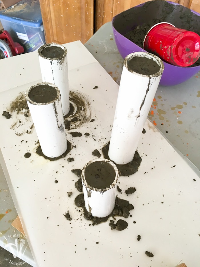 I love DIY cement projects. Make these easy paint dipped concrete firework picture holders to add some pictures of all your summer fun to your 4th of July decor. | Housefulofhandmade.com