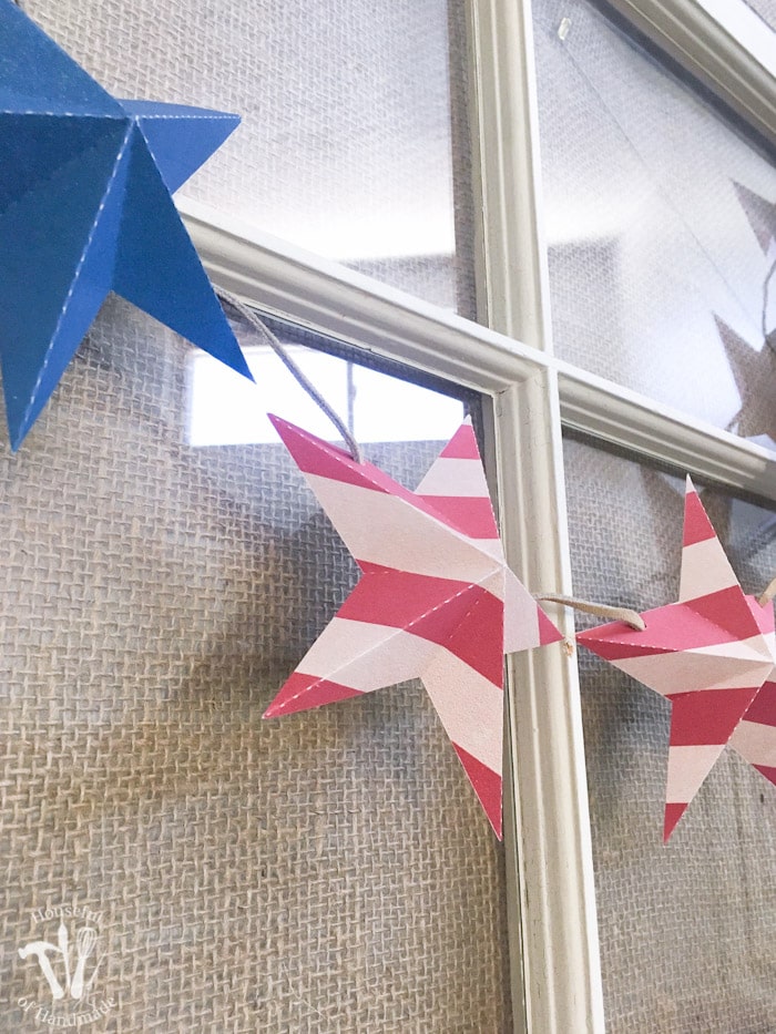 Decorate for a summer of barbecues and July 4th with this free printable stars and stripes patriotic banner. A quick 10 minute craft so you can get back to your summer. | Housefulofhandmade.com