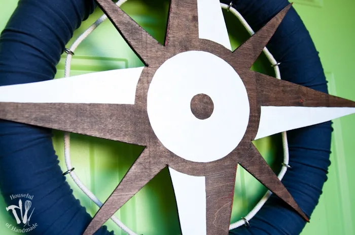 I love nautical decoration for summer! Make this fun nautical compass wreath to decorate your door with this year. | Housefulofhandmade.com