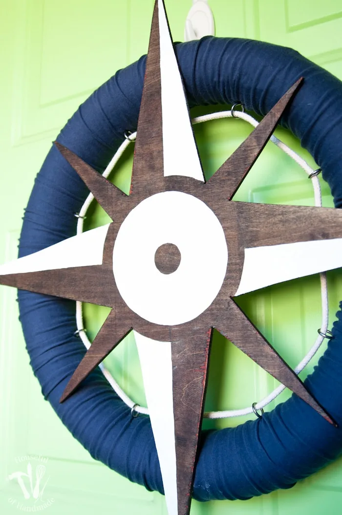 I love nautical decoration for summer! Make this fun nautical compass wreath to decorate your door with this year. | Housefulofhandmade.com