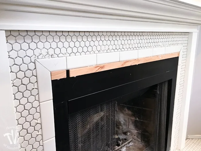 Remodeling our fireplace to make a beautiful, vintage inspired, farmhouse fireplace. All the details on Housefulofhandmade.com
