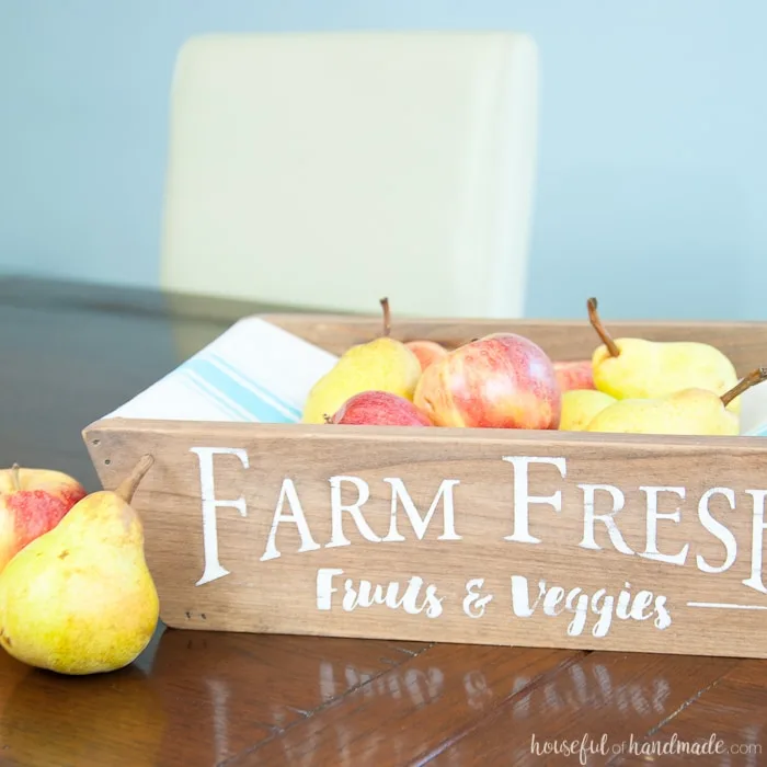 This is the most beautiful way to hold fruits and vegetables on the counter! This easy to make DIY farmhouse style produce basket is a fun twist on a fruit crate. Perfect fall centerpiece to display all the produce from your garden. | Housefulofhandmade.com