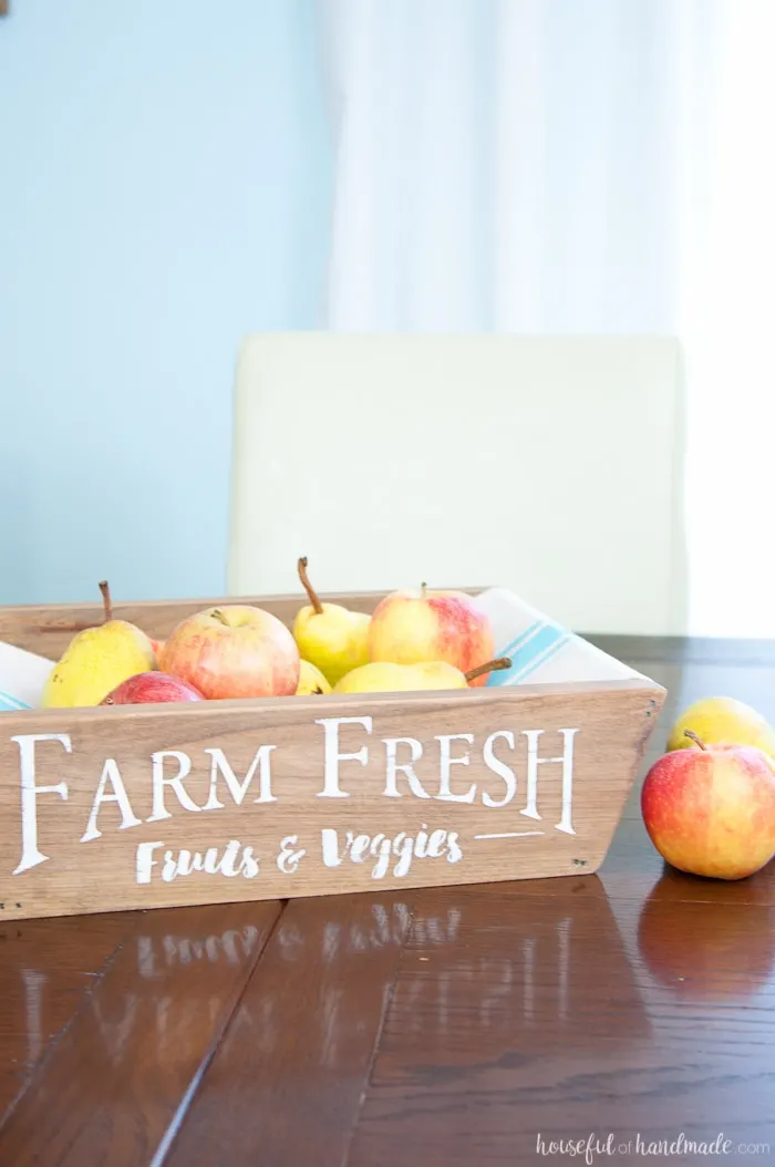 This is the most beautiful way to hold fruits and vegetables on the counter! This easy to make DIY farmhouse style produce basket is a fun twist on a fruit crate. Perfect fall centerpiece to display all the produce from your garden. | Housefulofhandmade.com