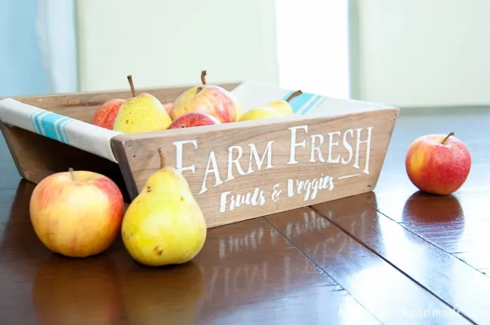 This is the most beautiful way to hold fruits and vegetables on the counter! This easy to make DIY farmhouse produce basket is a fun twist on a fruit crate. Perfect fall centerpiece to display all the produce from your garden. | Housefulofhandmade.com