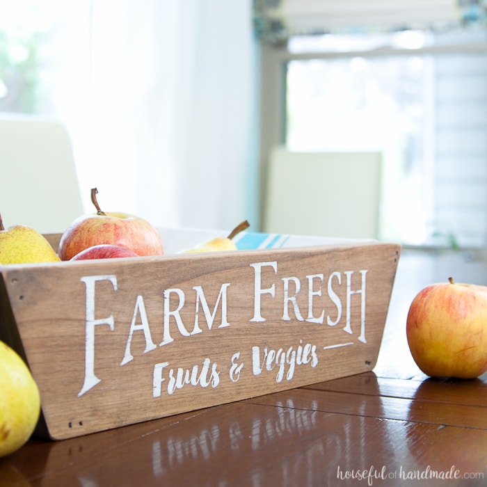 This is the most beautiful way to hold fruits and vegetables on the counter! This easy to make DIY farmhouse produce basket is a fun twist on a fruit crate. Perfect fall centerpiece to display all the produce from your garden. | Housefulofhandmade.com