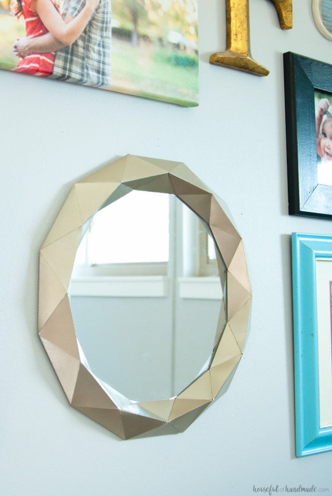I cannot believe what she used to make this mirror! Decorating your home can get expensive, unless you get creative. This easy $10 Anthropologie mirror knock off tutorial shows you how to get huge style without the huge price tag. | Housefulofhandmade.com